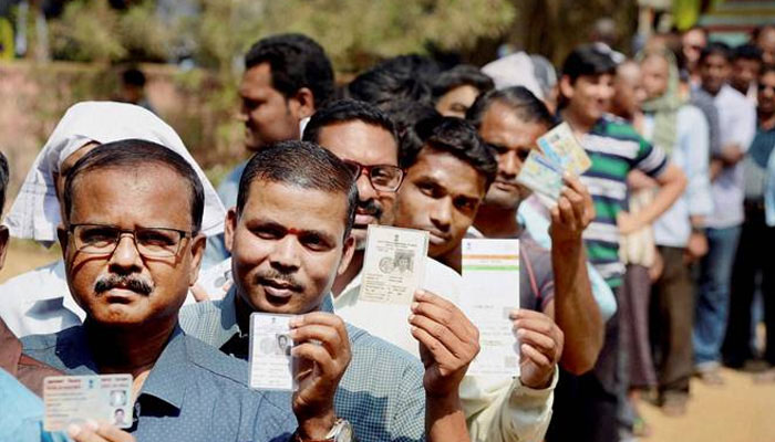 People line up outside polling booth for casting their vote 