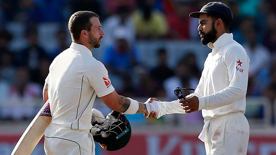 Matthew Wade shakes hands with Virat Kohli after play on the final day ended, India v Australia, 3rd Test, Ranchi, 5th day