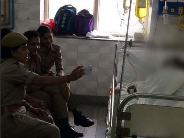 Three female constables taking selfies 
