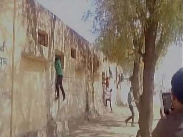 Children climbing school wall for helping students in Boards examination 