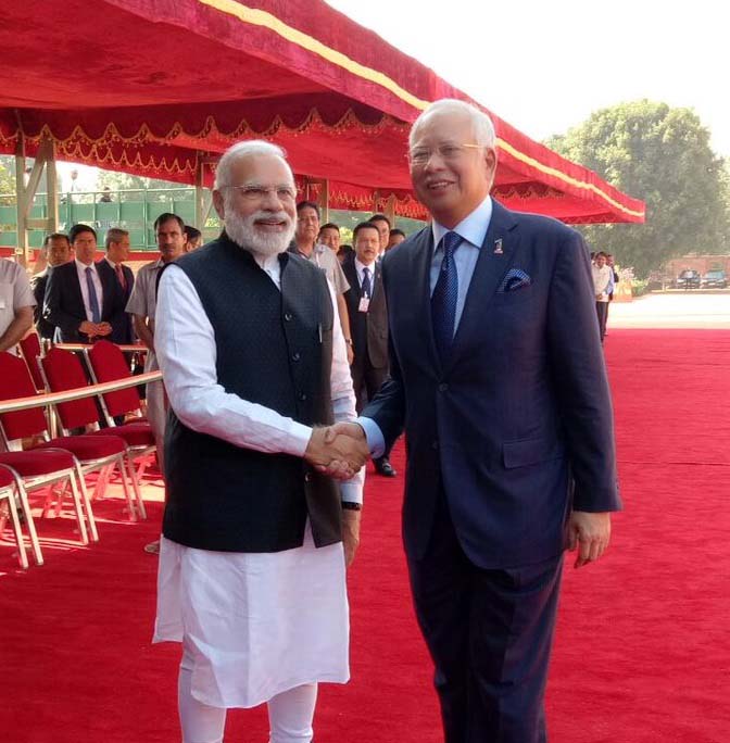 Prime Minister Narendra Modi shaking hands with Malaysian Prime Minister Mohammad Najib Tun Abdul Razak