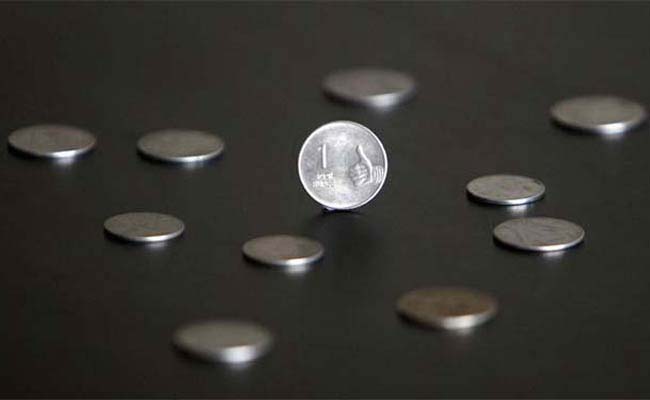 Rupee gains by 23 paise 