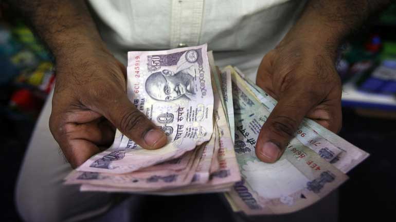 Rupee slips to 64.45 paise