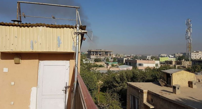 Smoke rises in western Kabul after a reported suicide blast caused multiple casualties.