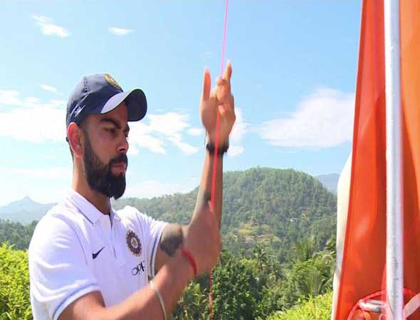 Indian skipper Virat Kohli hoists  the national flag 