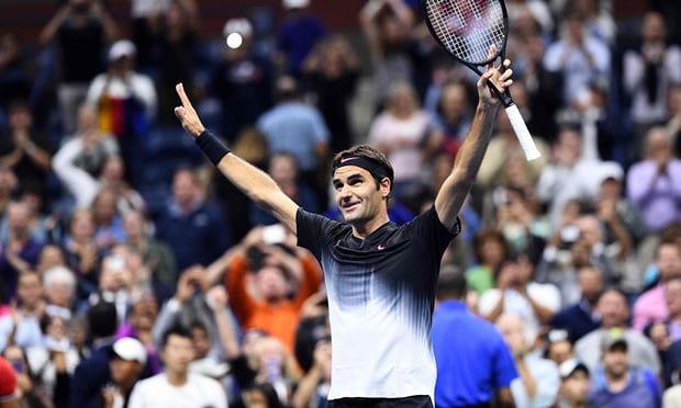 Roger Federer celebrates defeating Frances Tiafoe of the United States