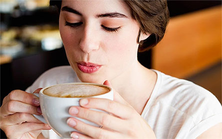 A girl sipping coffee