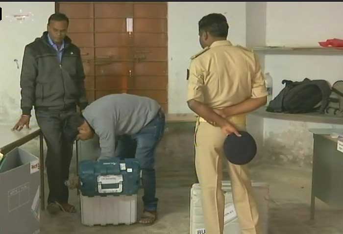After voting, EVM is being sealed by polling officers 