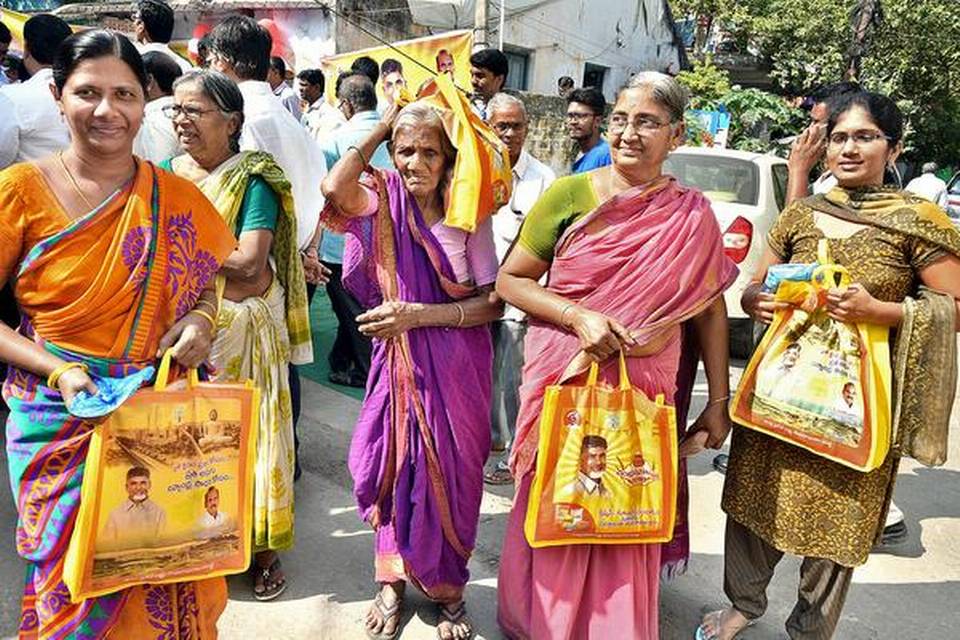 Women walking away with the Chandranna Christmas package 