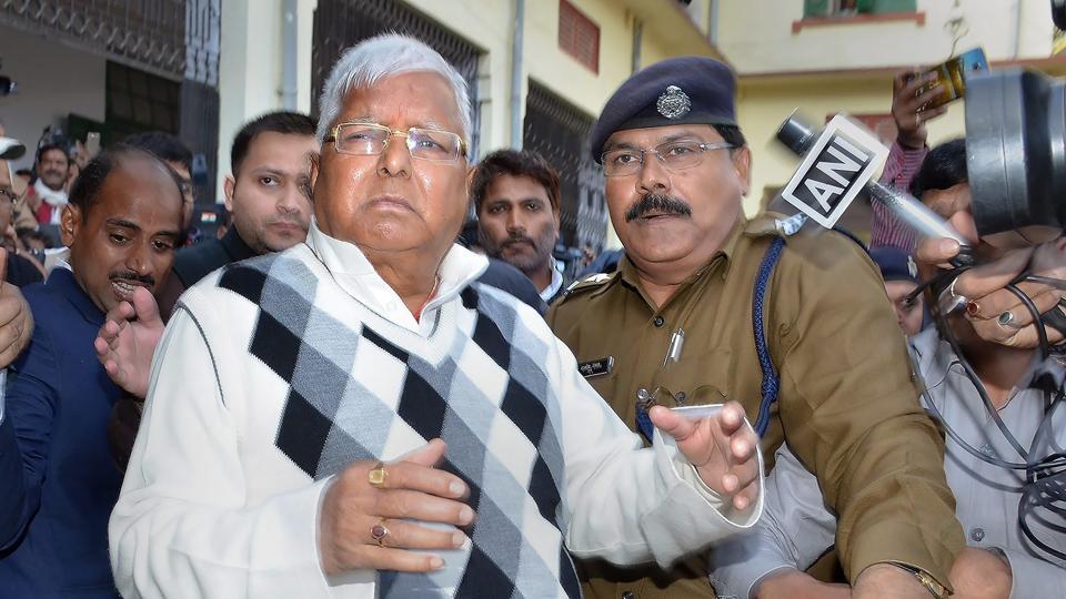 RJD supremo Lalu Prasad Yadav is escorted by police officials after being convicted by the special CBI court in fodder scam case