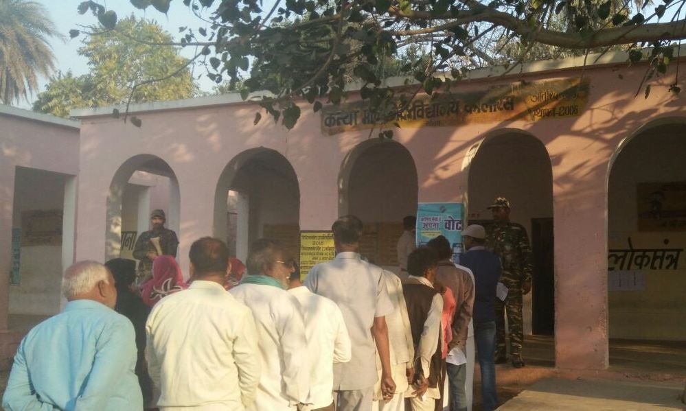 People standing in a queue to cast their votes 