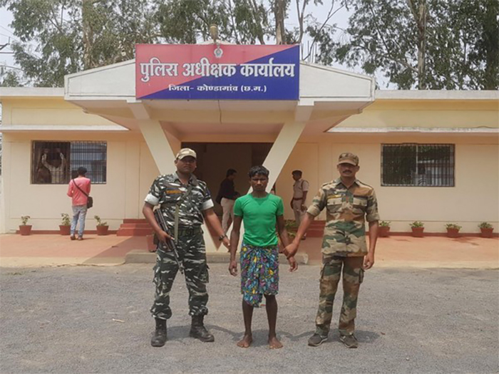 Police with arrested naxal