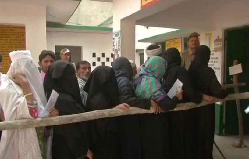 Voters standing in queue 