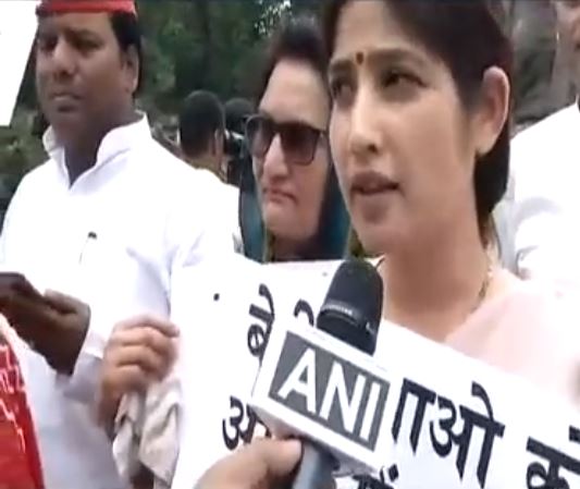 SP MP Dimple Yadav was seen holding a placard