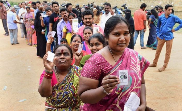 Women standing in row to cast vote