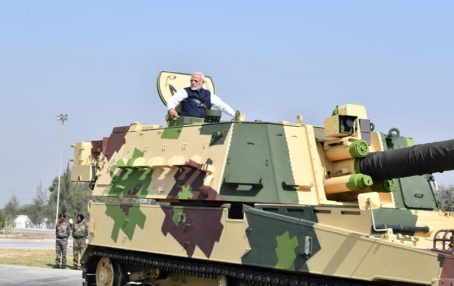 PM Modi taking ride in L&T-built howitzer