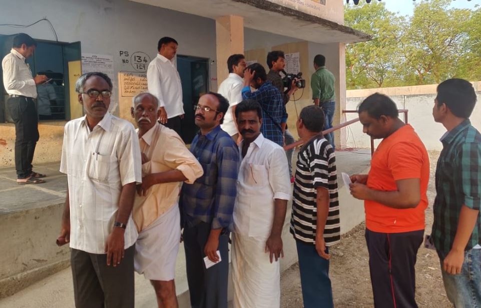 People Standing in queue to cast their vote