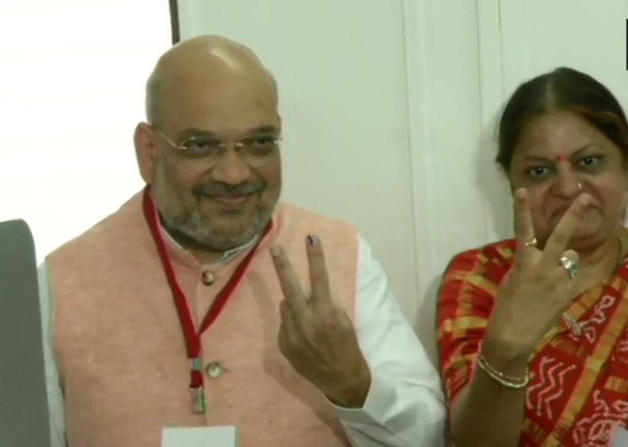 BJP national president Amit Shah and his wife Sonal Shah cast their votes