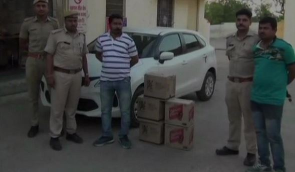 Two held with cartons of liquor