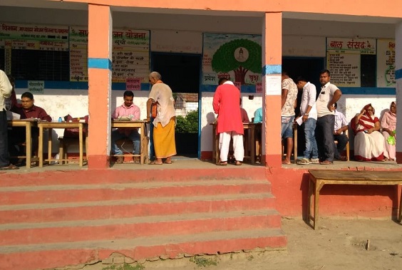 Voters line up outside polling booths