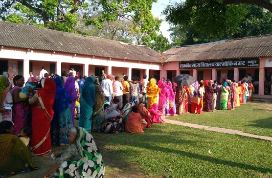 Voters line up outside polling booths