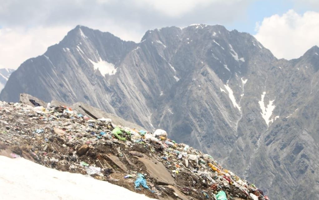 The hills near the lake are mounted with a stockpile of plastic bottles and polythene
