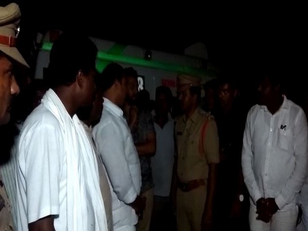 Police officials and family of the missing person at the spot of the accident in Suryapet