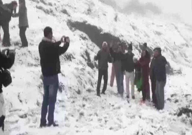 People enjoying the snow in Darjeeling's Tiger Hill