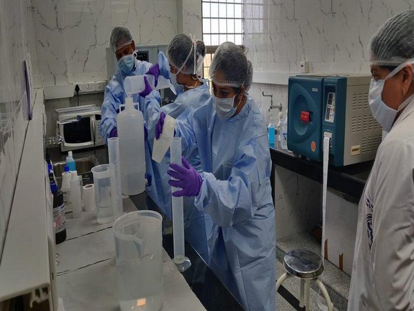 Doctors at AIIMS, Delhi making hand sanitizers in laboratory.