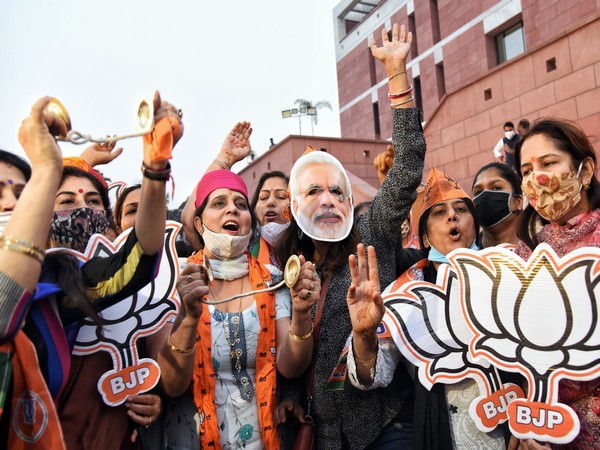 BJP supporters celebrate party's victory at party headquarters in New Delhi