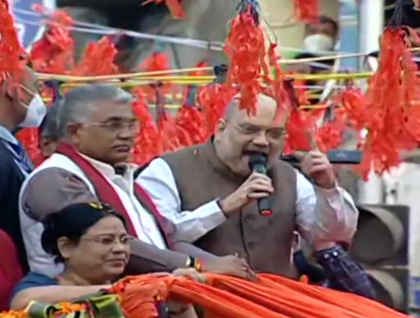 Union Home Minister Amit Shah (speaking) accompanied by WB BJP chief Dilip Ghosh (to his right) at a roadshow in Birbhum district on Sunday