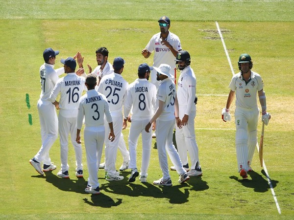 Team India celebrates after picking a wicket