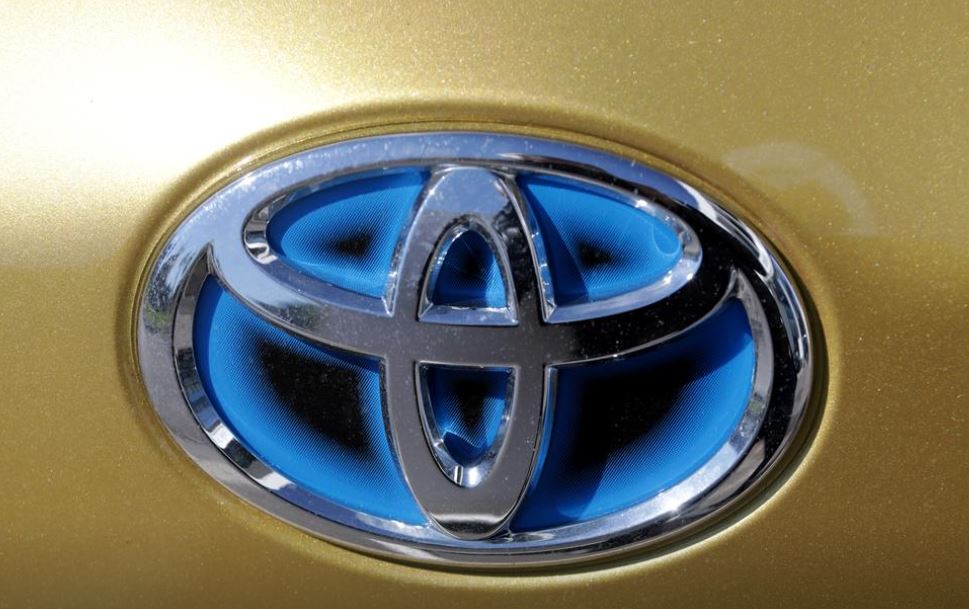 The logo of Toyota carmaker is seen on a car in Nice