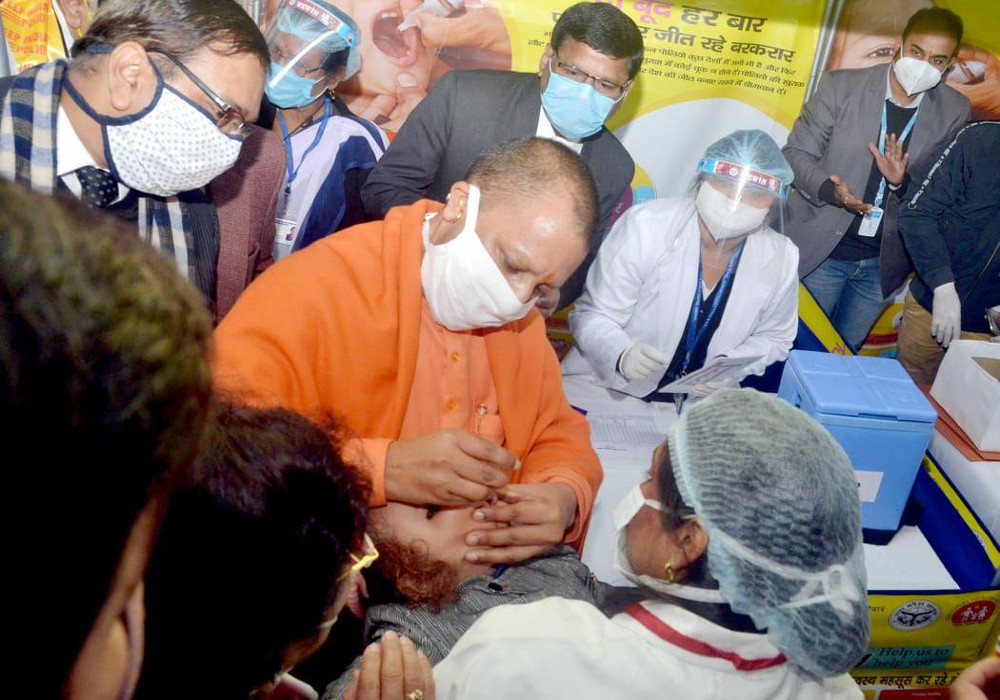 CM Yogi administering polio doses at launch of the event