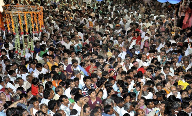 A massive crowd of devotees were seen flouting COVID-related guidelines at Shri Bankey Bihari Ji Temple