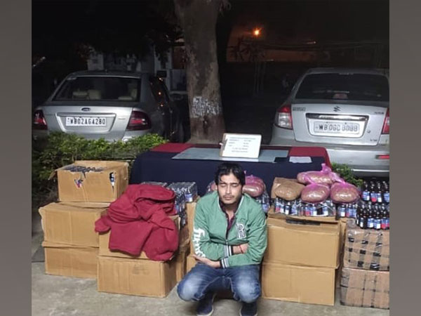 Accused Krishnapada Paul with seized phensedyl bottles
