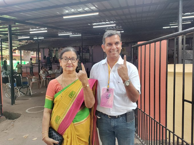 Aam Aadmi Party's Goa Chief Minister candidate Amit Palekar accompanied by his mother.