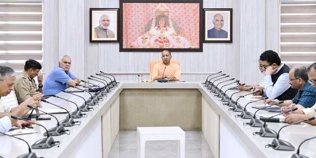 Uttar Pradesh Chief Minister Yogi Adityanath holding a meeting with  chairmen of various COVID-19 management committees