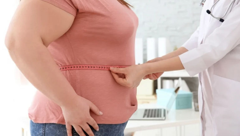 A doctor is examining a woman