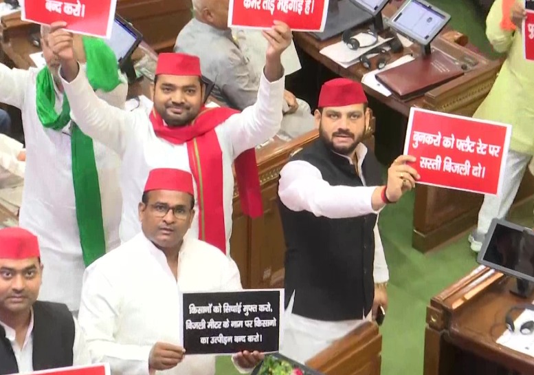 Samajwadi Party members marching into the well of the House during the governor's address