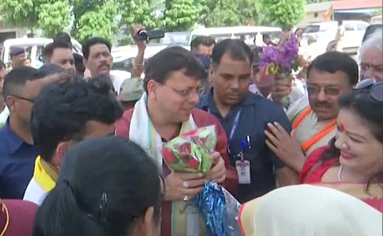 Uttarakhand CM Pushkar Singh Dhami is greeted by his supporters