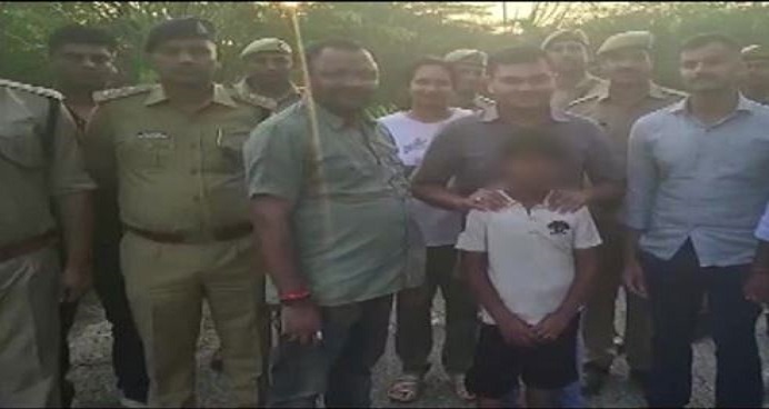 Police with the boy who was kidnapped