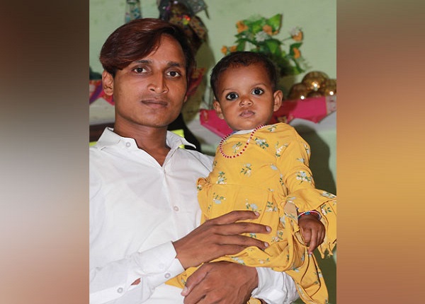 18-month-old Mahira with her father