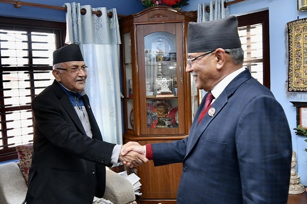 Nepal's Maoist Center Chairman Pushpa Kamal Dahal with Unified Marxist-Leninist president KP Sharma Oli