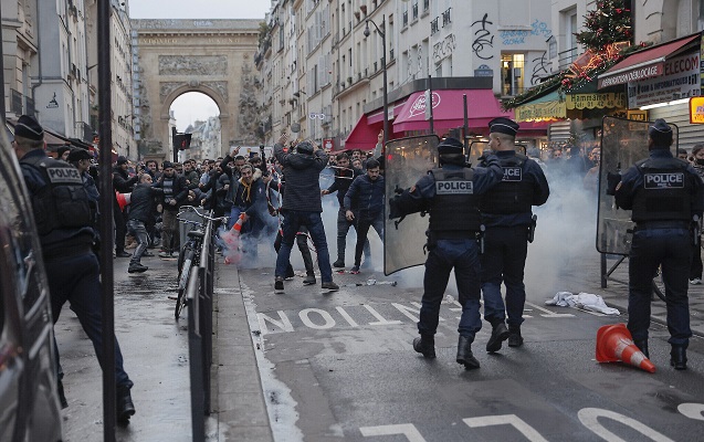 Members of the Kurdish community gather at the Place de la Republique square following the shooting, in Paris.