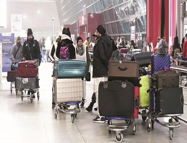 Passengers at Delhi's IGI airport on Wednesday