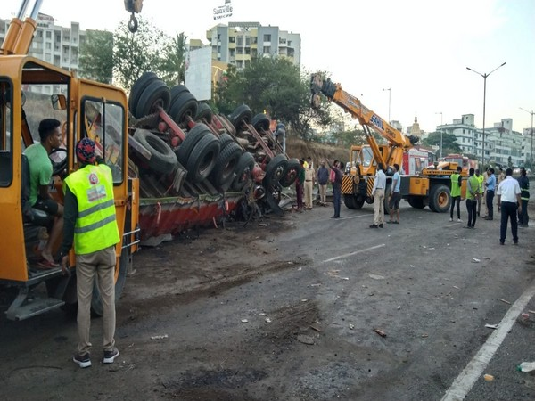 Overturned truck after collision with a bus
