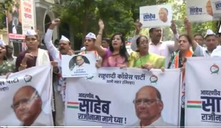 NCP workers raise slogans in support of Sharad Pawar
