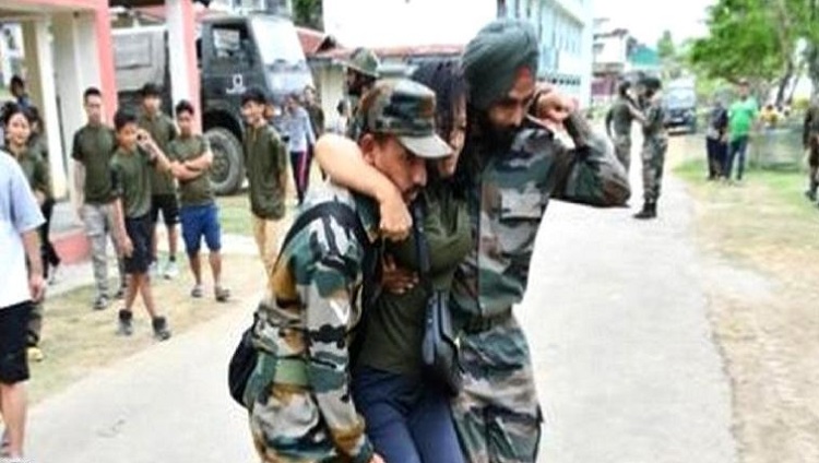 Indian Army jawans helping out a civilian in Manipur