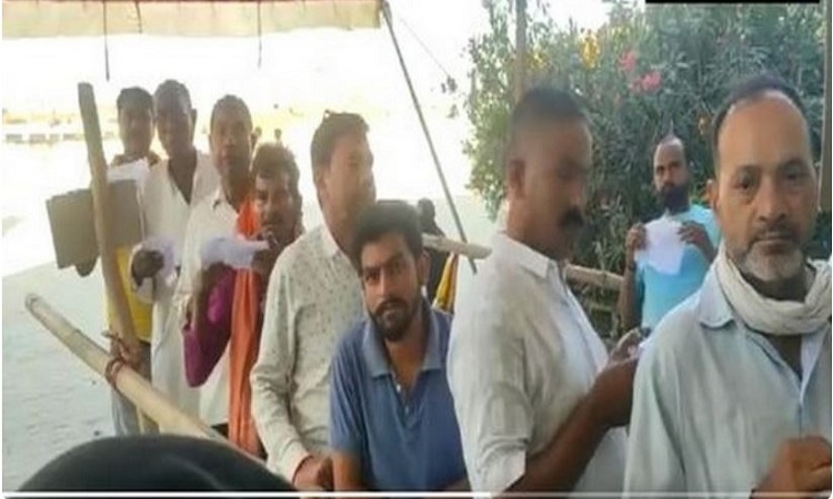 People line up to vote in bypoll to Suar Assembly seat in Uttar Pradesh
